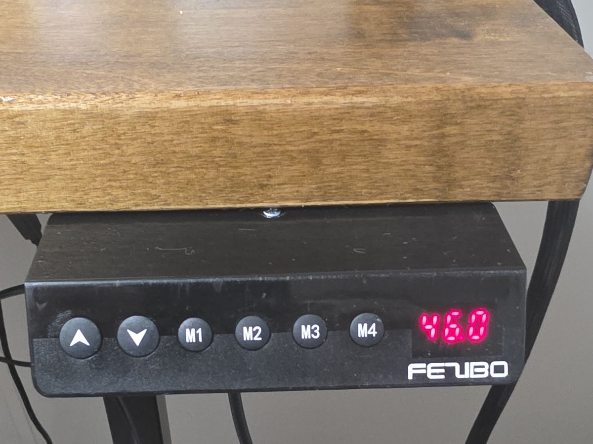 The FEZIBO controller on my desk frame, showing 46.0